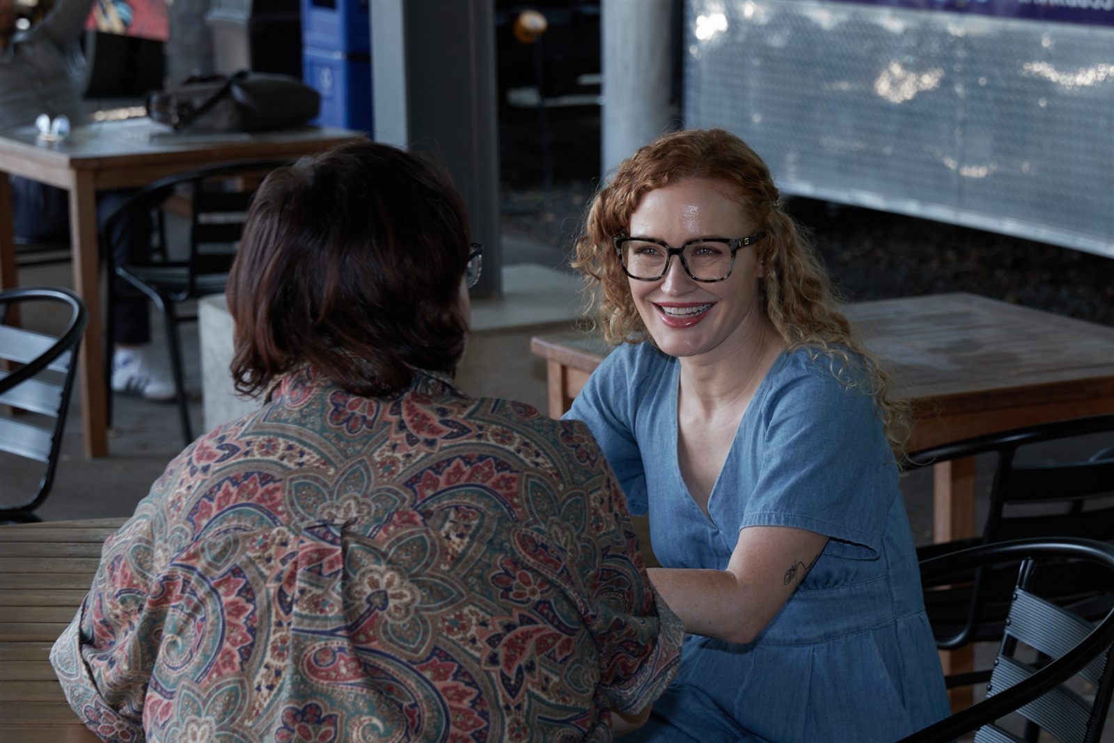 Carrie Davidson in a calm conversation across a table
